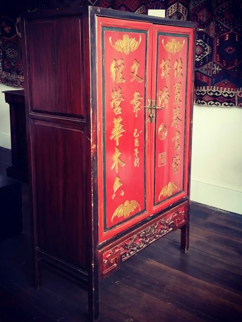 Chinese red lacquer pillow cupboard c1919